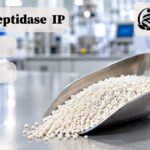 Serratiopeptidase IP enteric-coated granules in a laboratory scoop for pharmaceutical manufacturing